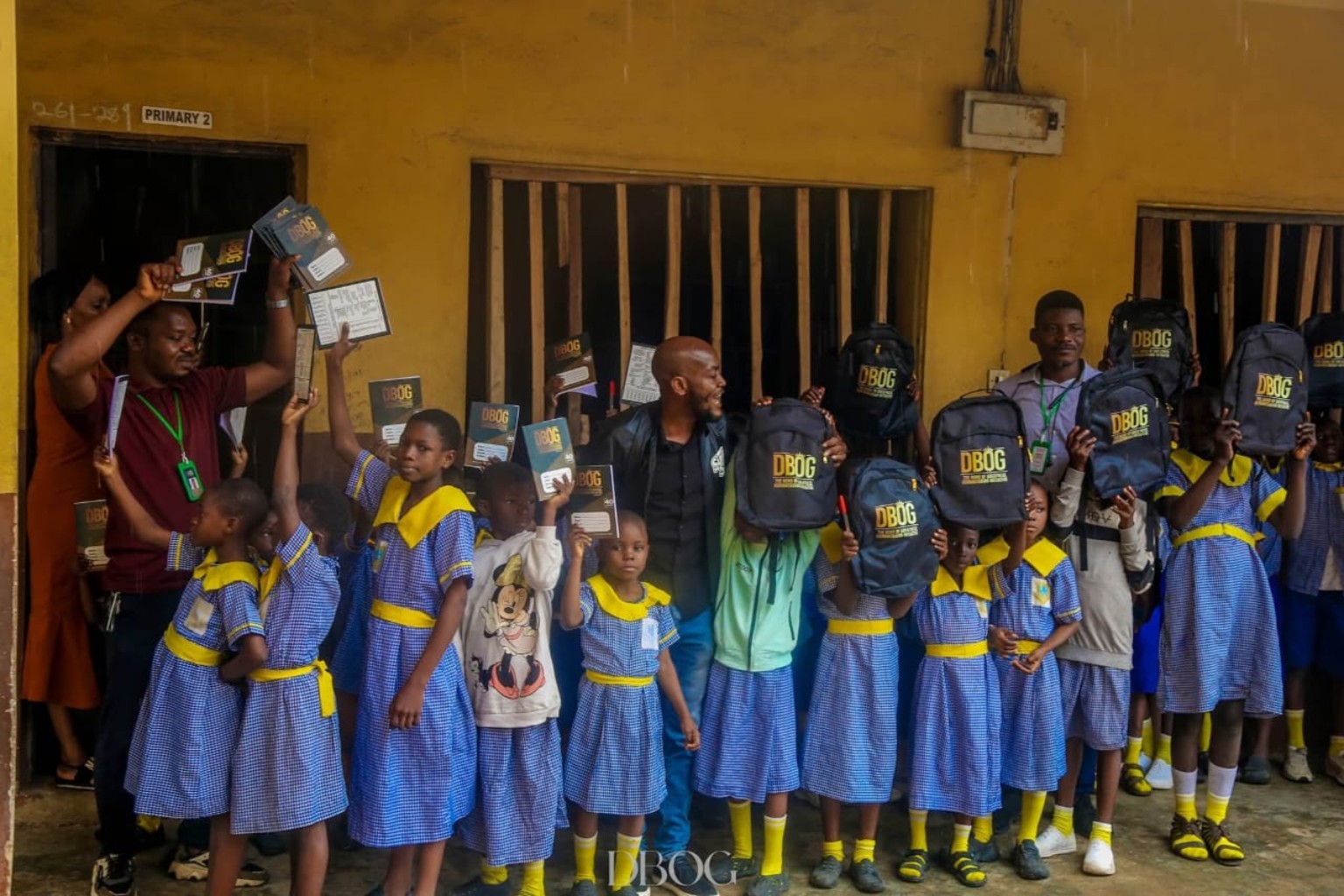DBOG volunteers distributing school supplies